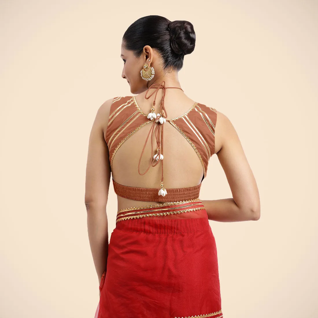 Ahana x Tyohaar | Metallic Copper Sleeveless FlexiFit™ Saree Blouse with Plunging Neckline and Back Cut Out with Tasteful Golden Gota Lace Embellishment