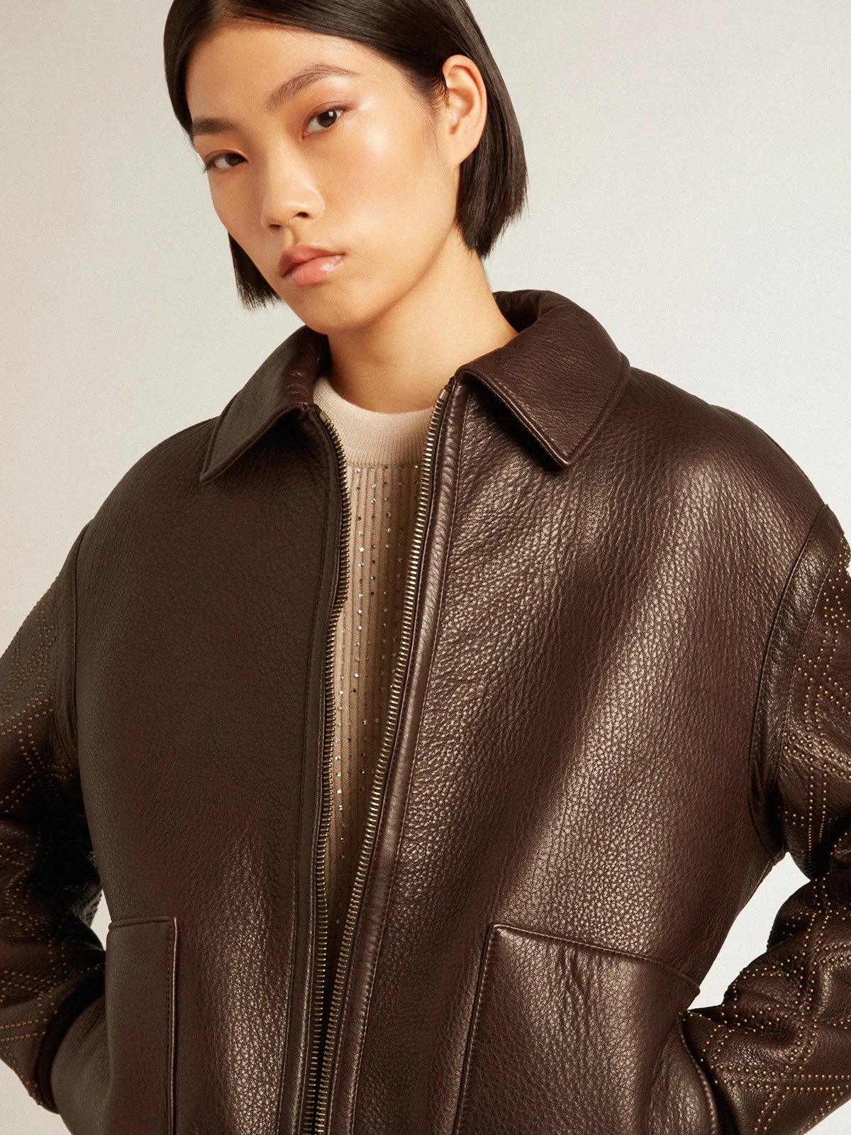 Brown nappa leather jacket with studded sleeves