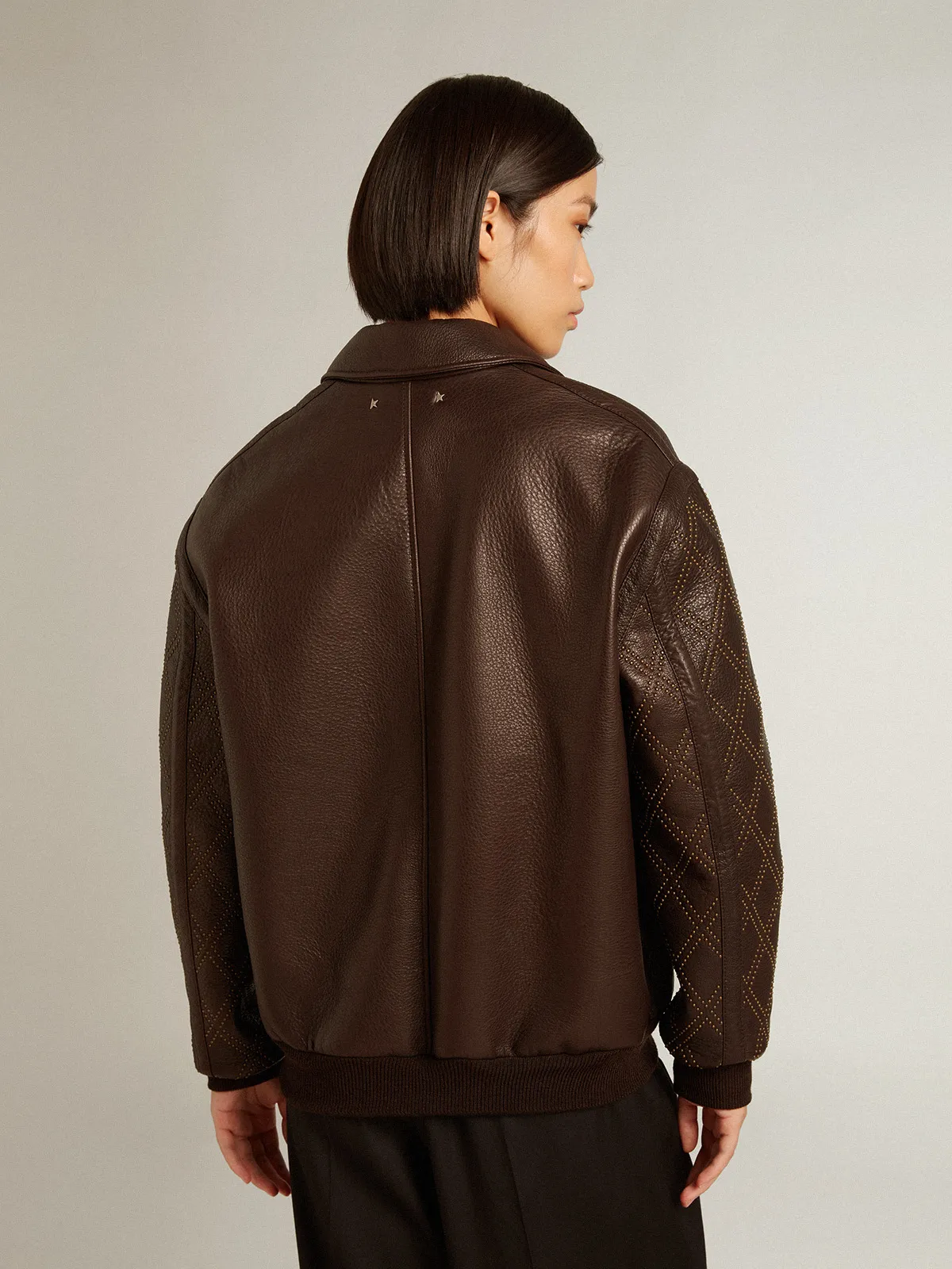 Brown nappa leather jacket with studded sleeves